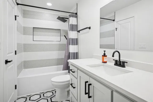 a bathroom with a sink a toilet and a bathtub