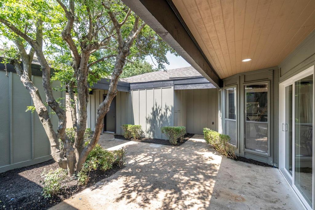 6030 Blue Mist Lane Dallas, TX 75248 - Photo 27 of 29 a front view of a house with garden