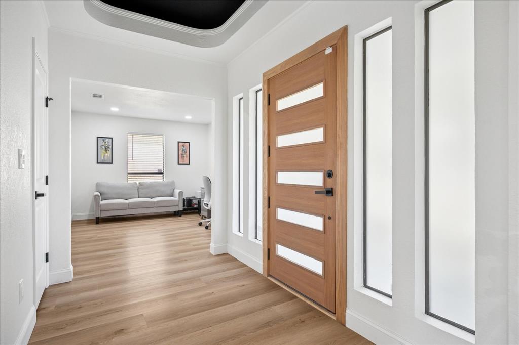 6030 Blue Mist Lane Dallas, TX 75248 - Photo 3 of 29 a view of a livingroom with wooden floor and furniture