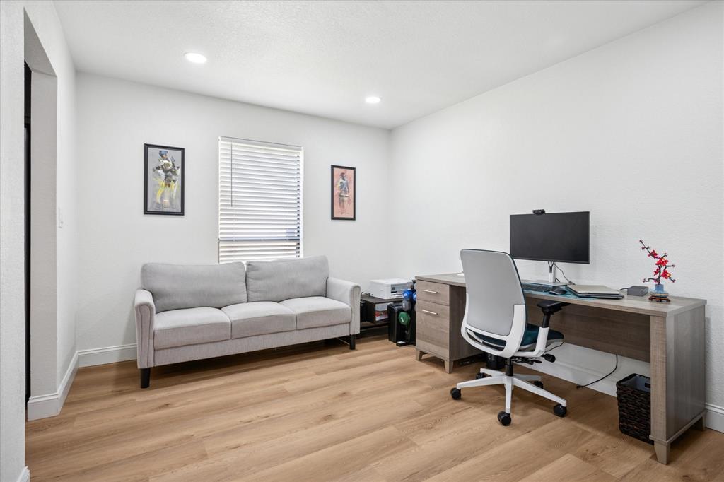 6030 Blue Mist Lane Dallas, TX 75248 - Photo 4 of 29 a livingroom with workspace and a couch
