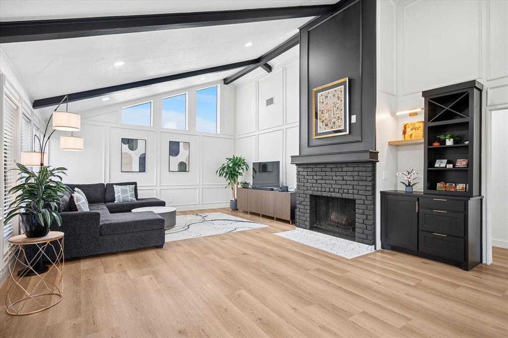 6030 Blue Mist Lane Dallas, TX 75248 - Photo 5 of 29 a living room with furniture and a fireplace