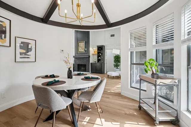 a view of a dining room with furniture window and wooden floor
