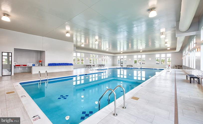 43290 Greeley Square Ashburn, VA 20148 - Photo 37 of 39 a dining hall with stainless steel appliances kitchen view and living room view