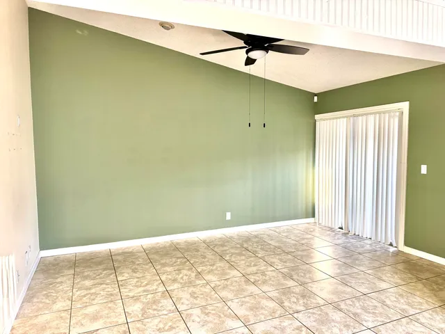 a kitchen with a sink a refrigerator and a stove top oven