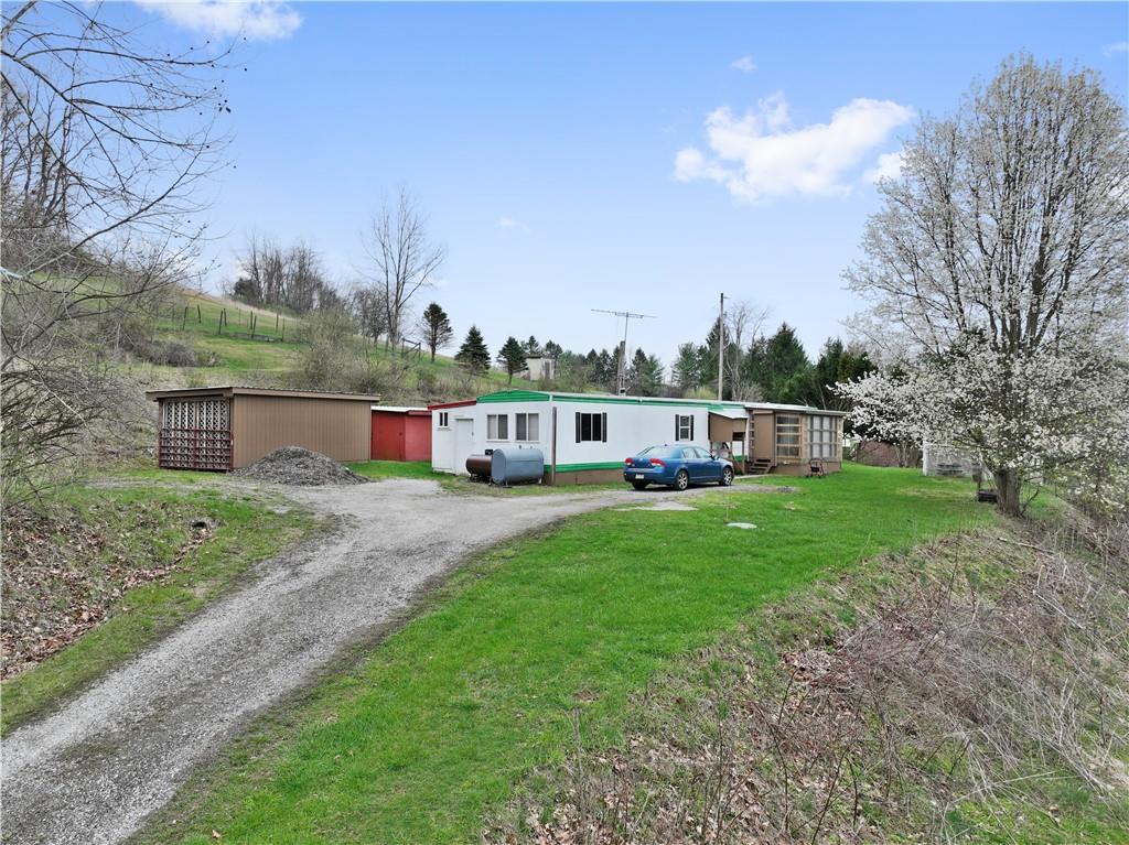 700 Sugar Run Road Eighty Four, PA 15330 - Photo 25 of 25 a view of a house with backyard sitting area and garden