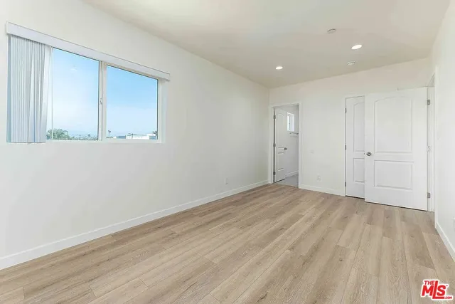 a bathroom with a sink toilet a mirror and shower