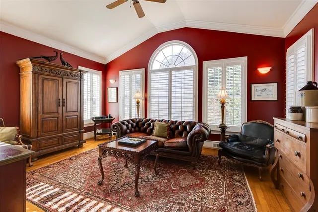 a living room with furniture windows and a fireplace