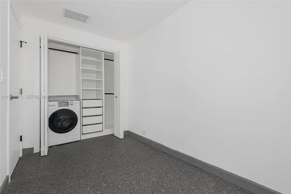 a view of a storage & utility room with a washer and dryer