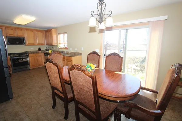 a view of a dining room with furniture window and outside view