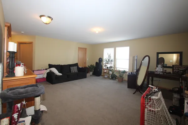 a bed room with furniture and a window