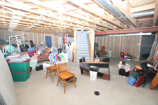 a living room filled with furniture and a chandelier