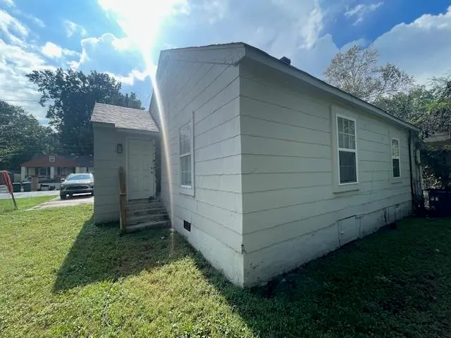 a backyard of a house with lots of green space