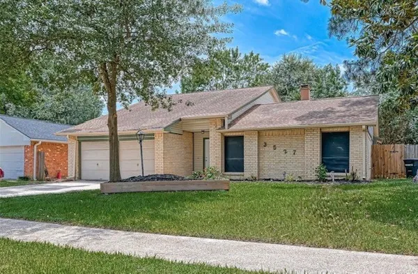 a front view of a house with a yard and porch