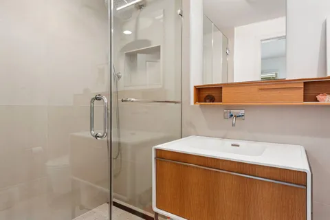 a bathroom with a sink and a shower