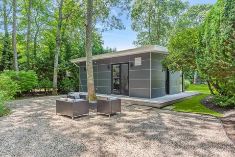 a backyard of a house with seating space