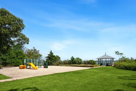 a view of a house with swimming pool and yard