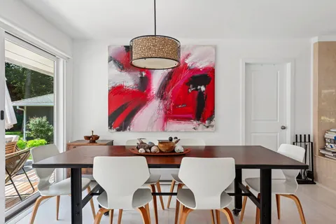 a view of a dining room with furniture window and outside view