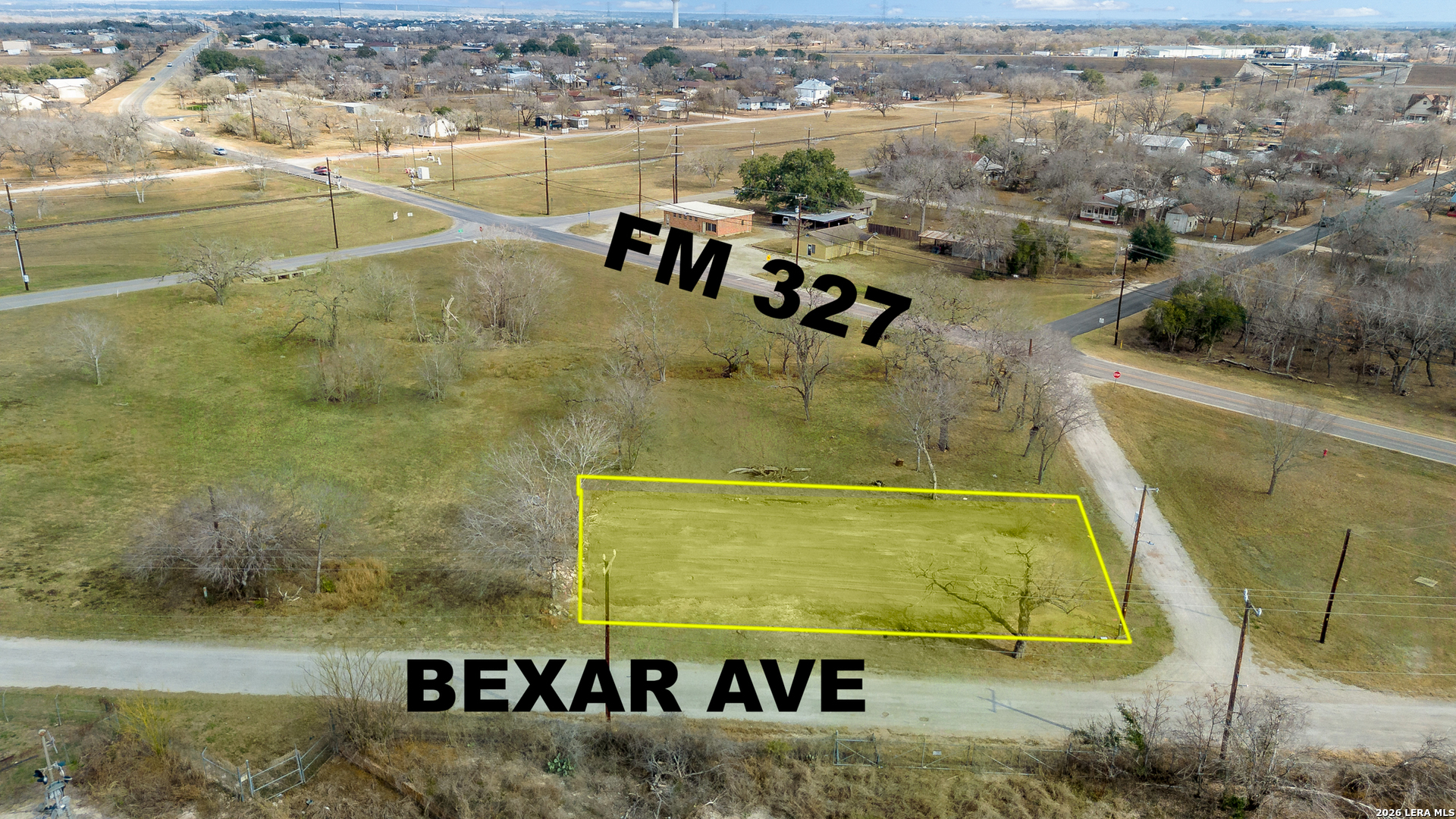 210 Bexar Elmendorf, TX 78112 - Photo 4 of 17 a view of swimming pool with a garden and seating area