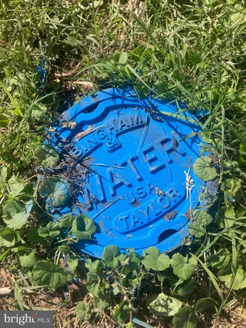 a view of a red gate with of a tree