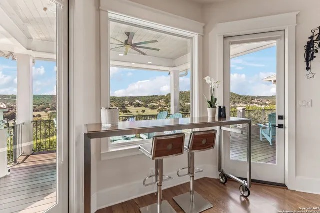 a view of a room with a large window