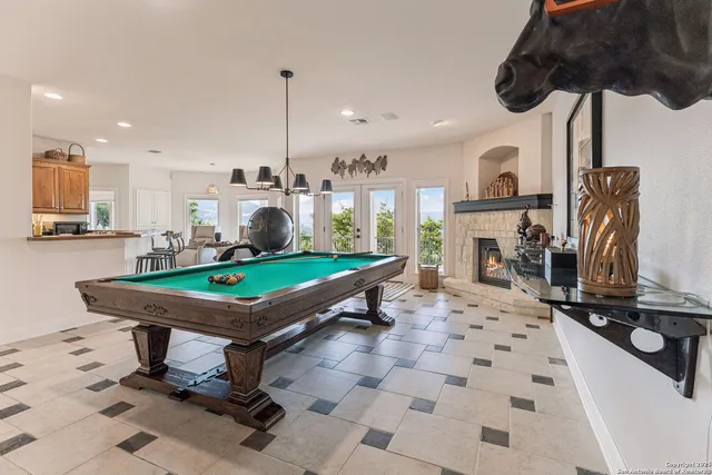 a bedroom with a large bed and a lamp on table