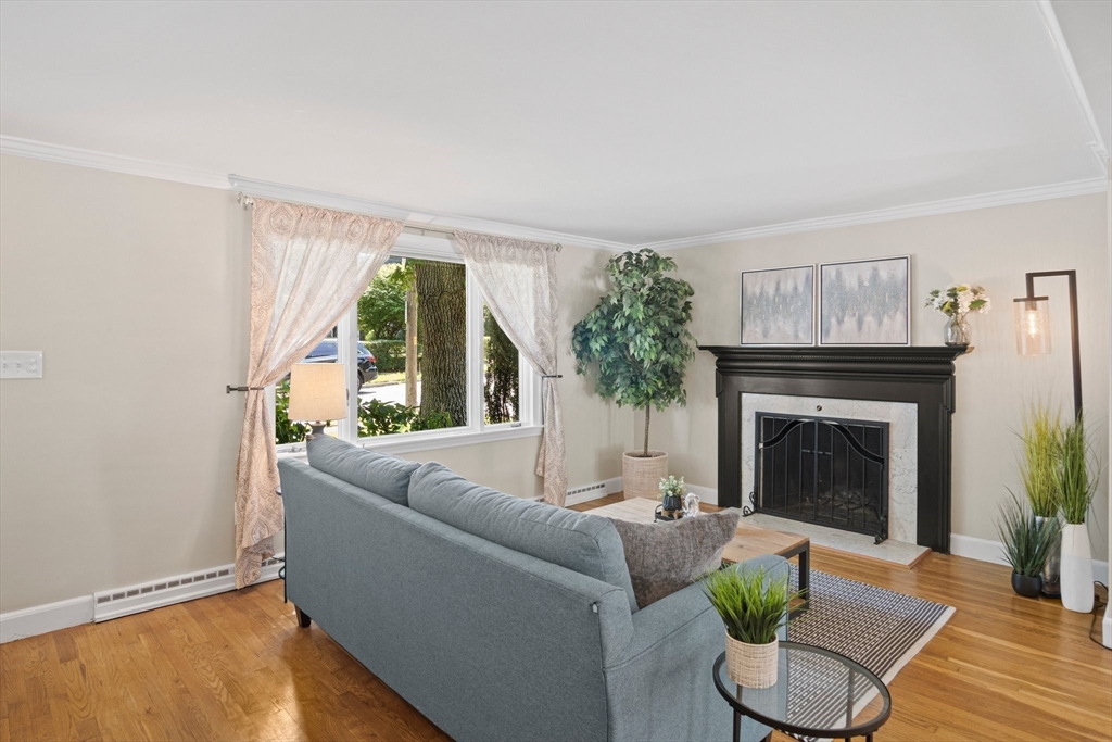 12 Renwick Road Melrose, MA 02176 - Photo 13 of 40 a living room with furniture and a fireplace