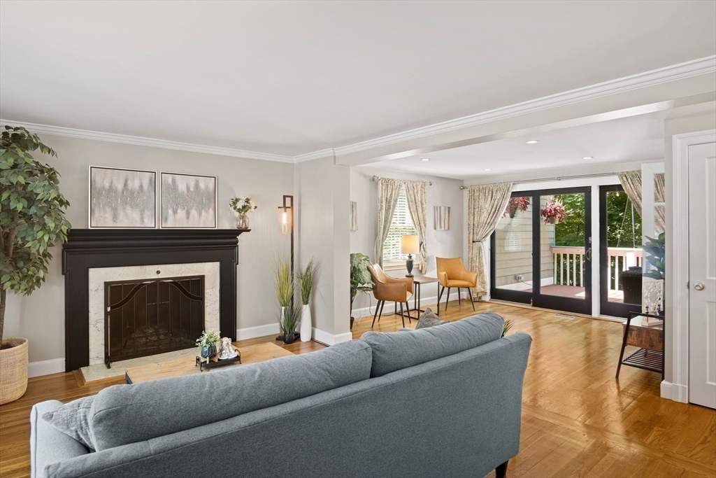 12 Renwick Road Melrose, MA 02176 - Photo 14 of 40 a living room with furniture and a fireplace