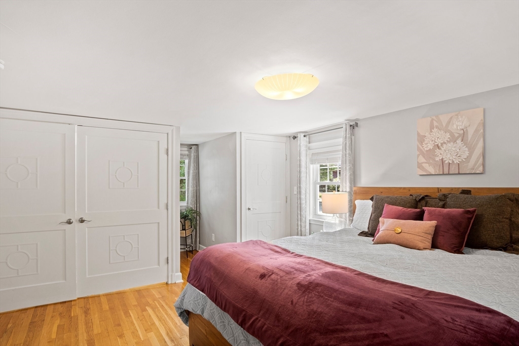 12 Renwick Road Melrose, MA 02176 - Photo 21 of 40 a bedroom with a bed and a painting on the wall