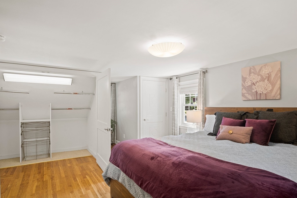 12 Renwick Road Melrose, MA 02176 - Photo 22 of 40 a bedroom with a bed and a walk in closet