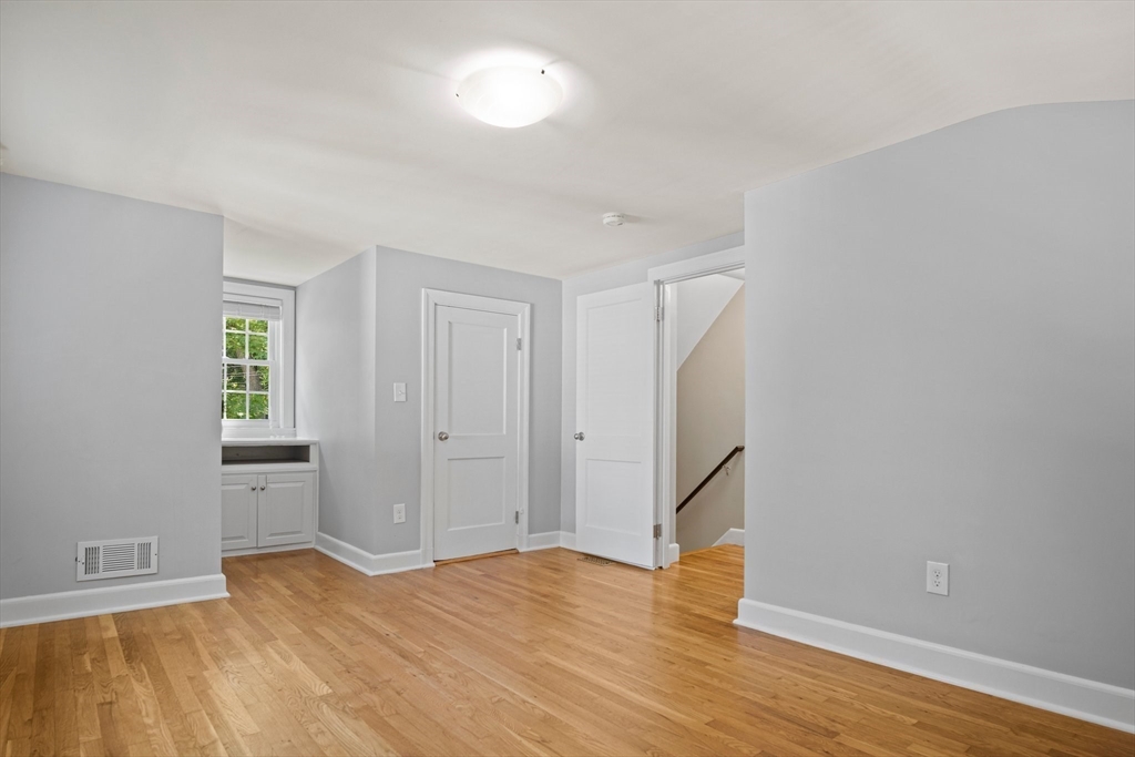 12 Renwick Road Melrose, MA 02176 - Photo 24 of 40 a view of empty room with wooden floor and fan