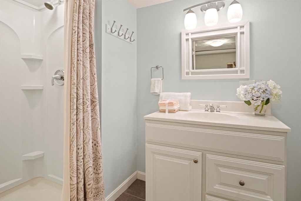 12 Renwick Road Melrose, MA 02176 - Photo 30 of 40 a bathroom with a sink a toilet and a mirror