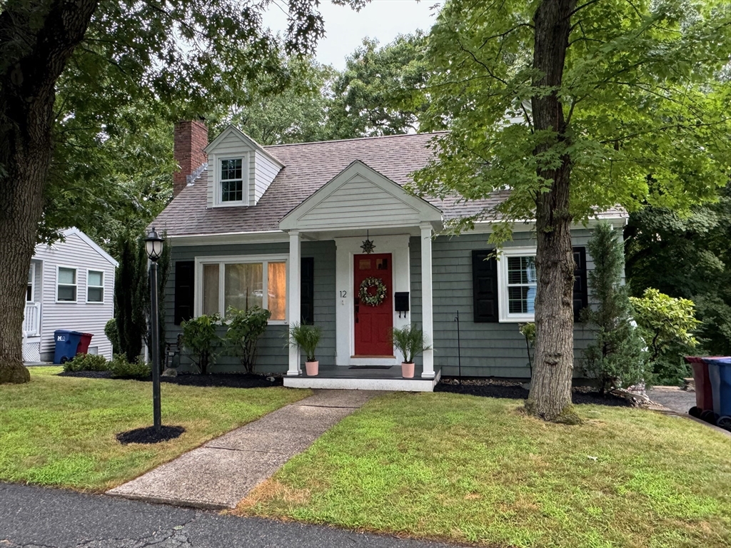 12 Renwick Road Melrose, MA 02176 - Photo 3 of 40 a front view of a house with a yard