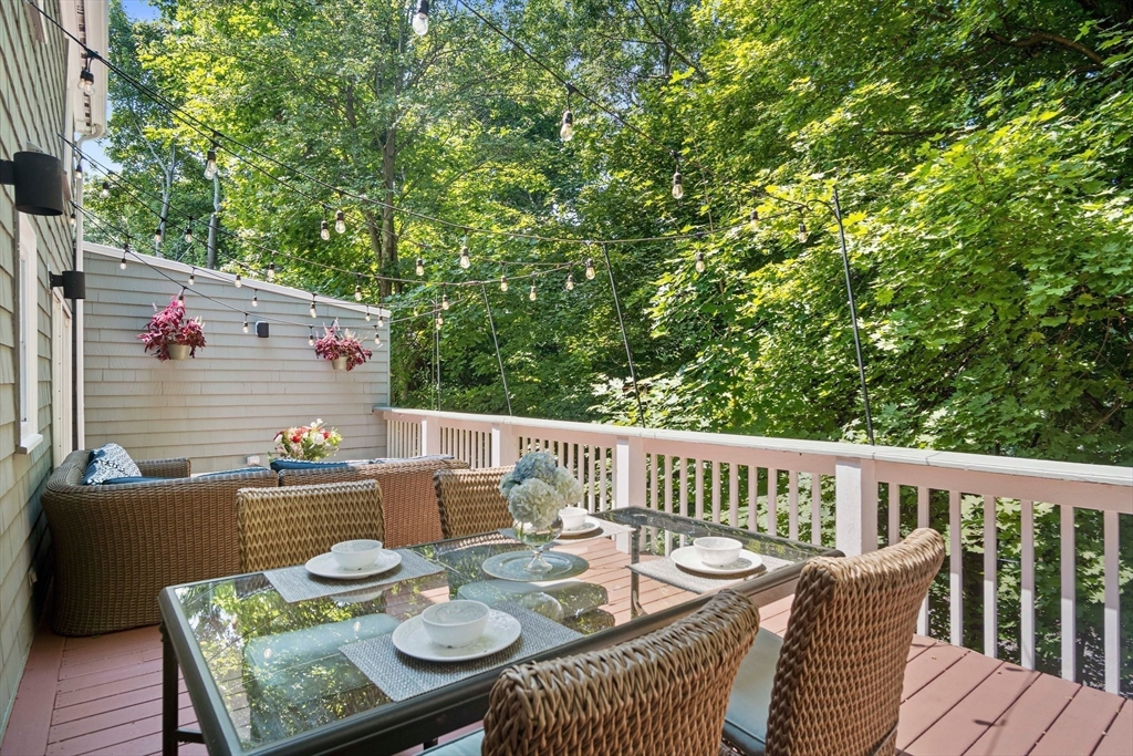 12 Renwick Road Melrose, MA 02176 - Photo 34 of 40 a view of a table and chairs on the roof deck