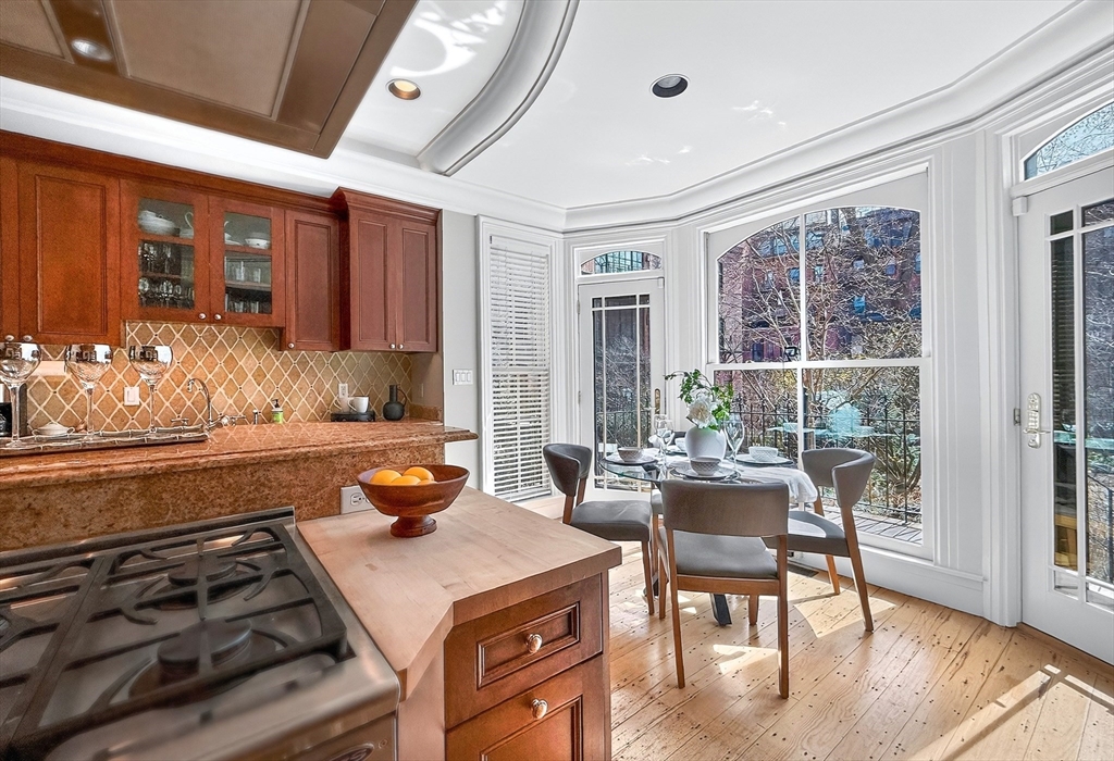 70 Montgomery Street Boston, MA 02116 - Photo 14 of 42 a kitchen with a stove and a view of living room