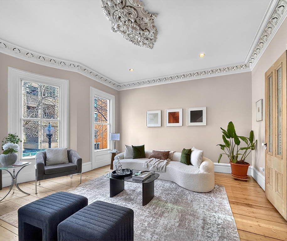 70 Montgomery Street Boston, MA 02116 - Photo 19 of 42 a living room with furniture or couch and a potted plant