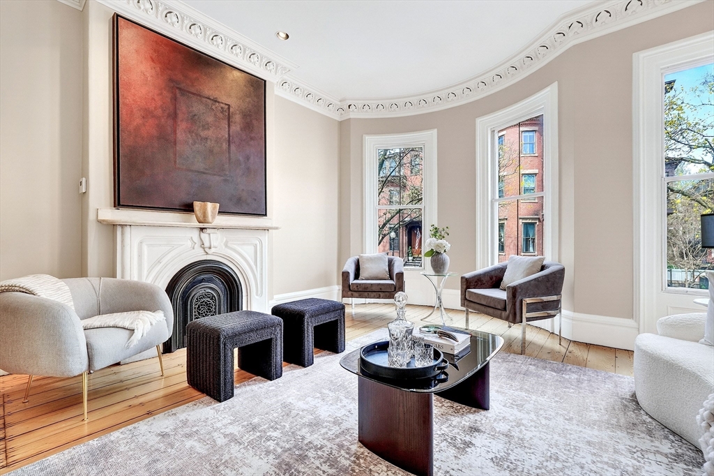 70 Montgomery Street Boston, MA 02116 - Photo 20 of 42 a living room with furniture a fireplace and a flat screen tv