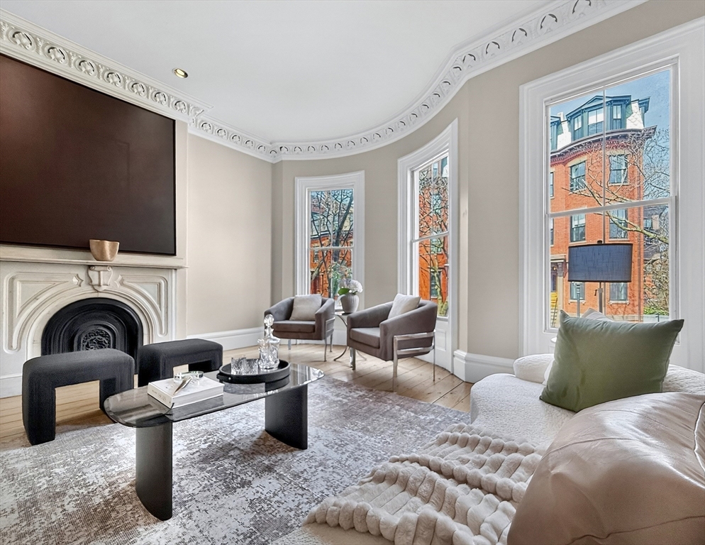 70 Montgomery Street Boston, MA 02116 - Photo 21 of 42 a living room with furniture and a fireplace
