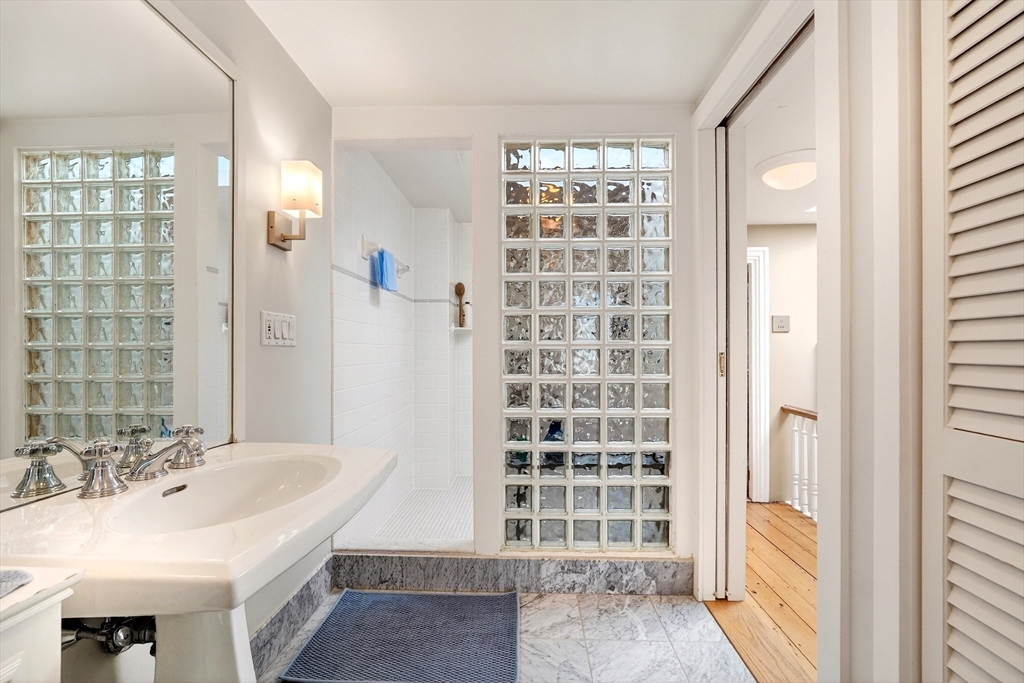 70 Montgomery Street Boston, MA 02116 - Photo 28 of 42 a bathroom with a sink a toilet and shower