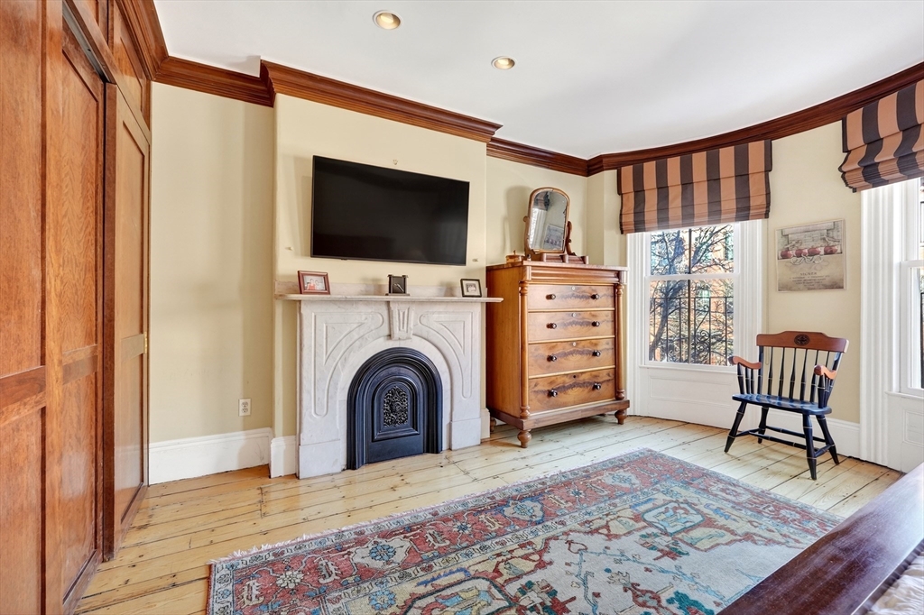 70 Montgomery Street Boston, MA 02116 - Photo 33 of 42 a living room with furniture and a flat screen tv