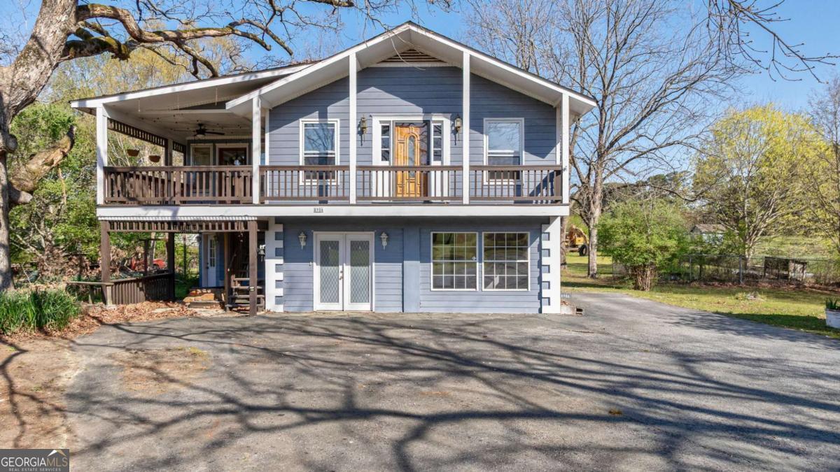 8986 Highway 29 Hull, GA 30646 - Photo 14 of 34 a front view of a house with a yard