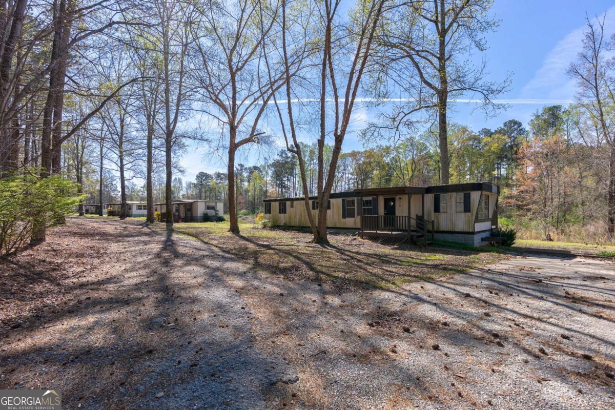 8986 Highway 29 Hull, GA 30646 - Photo 24 of 34 a view of a house with trees in the background