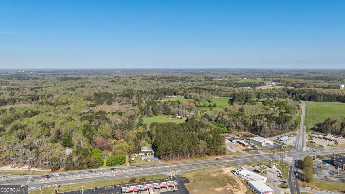 8986 Highway 29 Hull, GA 30646 - Photo 5 of 34 an aerial view of a house with a yard