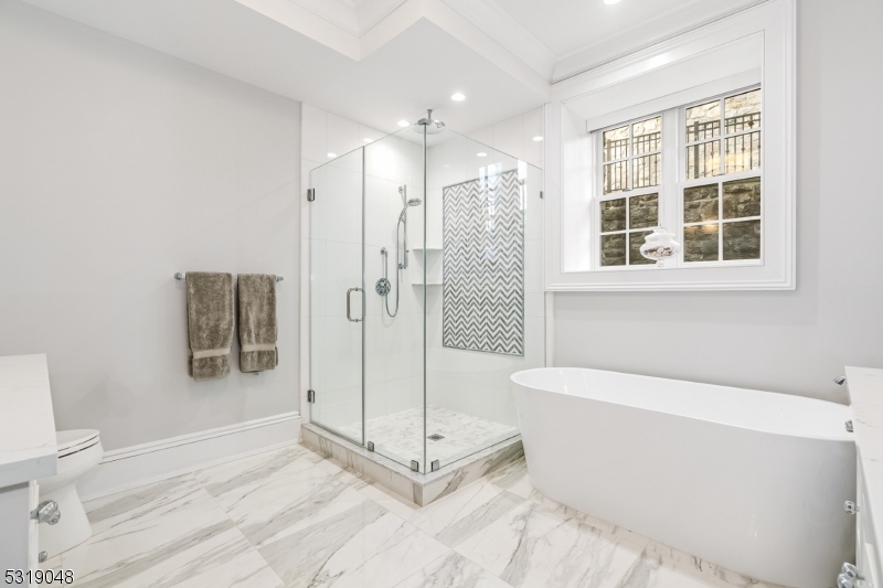 80 Claremont Road, Unit 802 Bernardsville, NJ 07924 - Photo 13 of 22 a bathroom with a bathtub and a shower