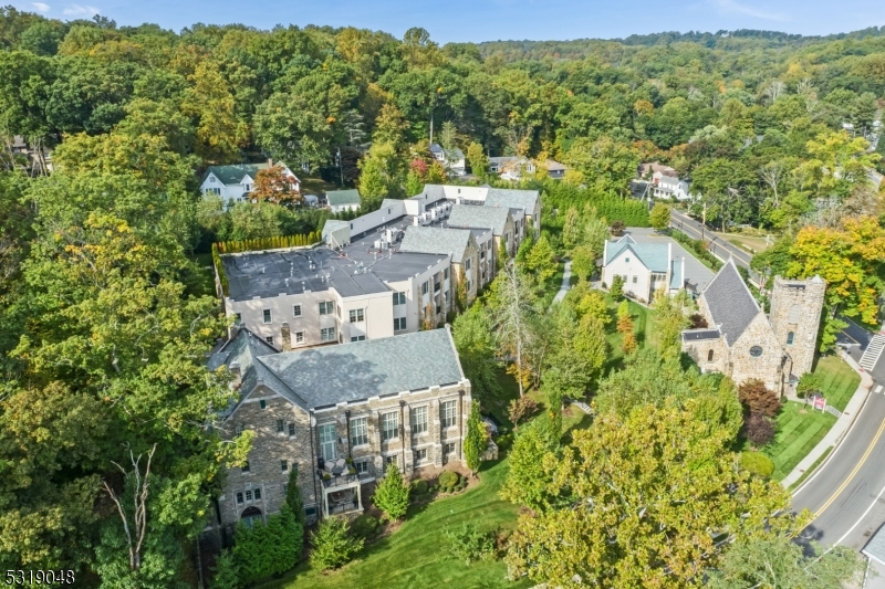 80 Claremont Road, Unit 802 Bernardsville, NJ 07924 - Photo 20 of 22 an aerial view of residential houses with outdoor space and trees all around
