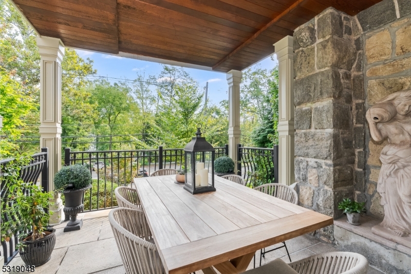 80 Claremont Road, Unit 802 Bernardsville, NJ 07924 - Photo 21 of 22 a view of a patio with a table chairs and a garden