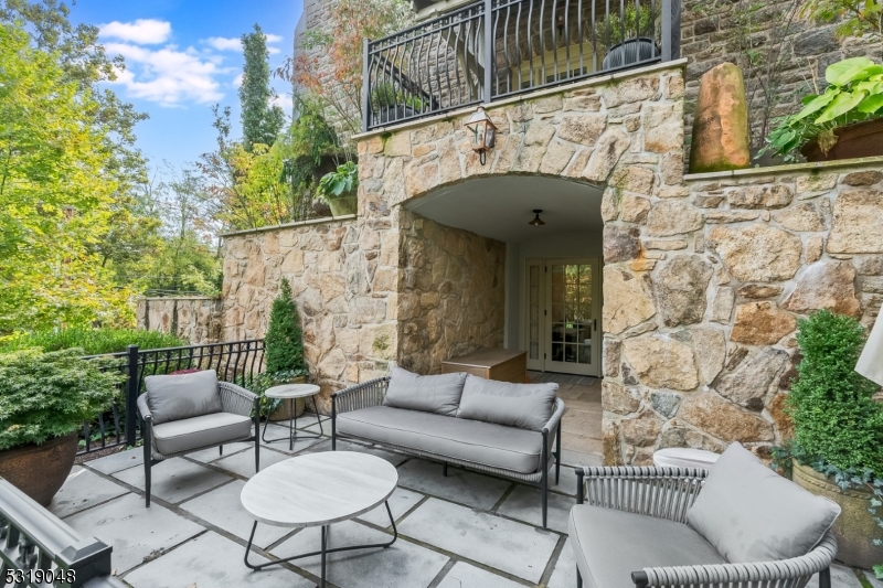 80 Claremont Road, Unit 802 Bernardsville, NJ 07924 - Photo 3 of 22 a view of a patio with couches table and chairs with potted plants