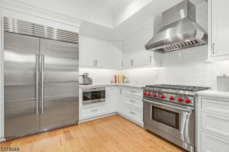 80 Claremont Road, Unit 802 Bernardsville, NJ 07924 - Photo 5 of 22 a kitchen with stainless steel appliances a stove and a refrigerator