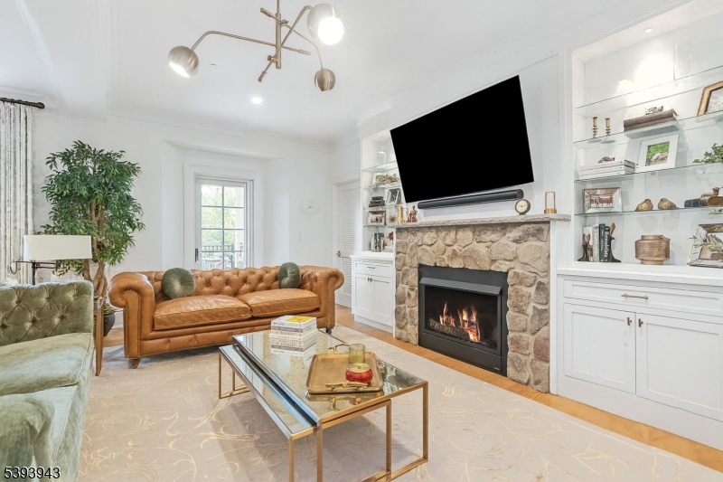 80 Claremont Road, Unit 802 Bernardsville, NJ 07924 - Photo 7 of 22 a living room with furniture fireplace and flat screen tv