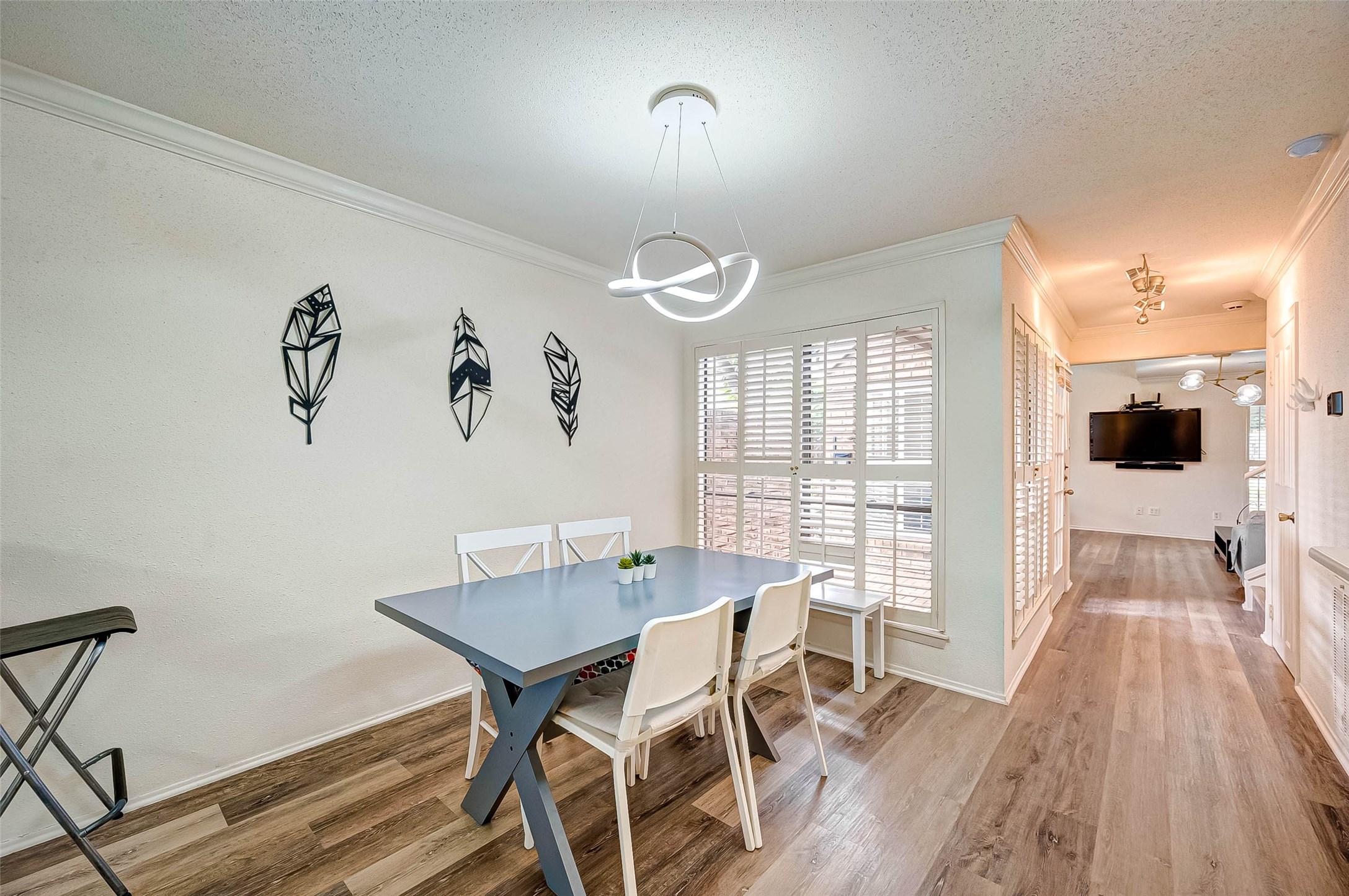 1908 Augusta Drive, Unit 7 Houston, TX 77057 - Photo 14 of 33 a view of a dining room with furniture window and wooden floor