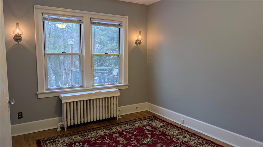 4068 Brandon Road Pittsburgh, PA 15212 - Photo 13 of 16 wooden floor in an empty room with a window